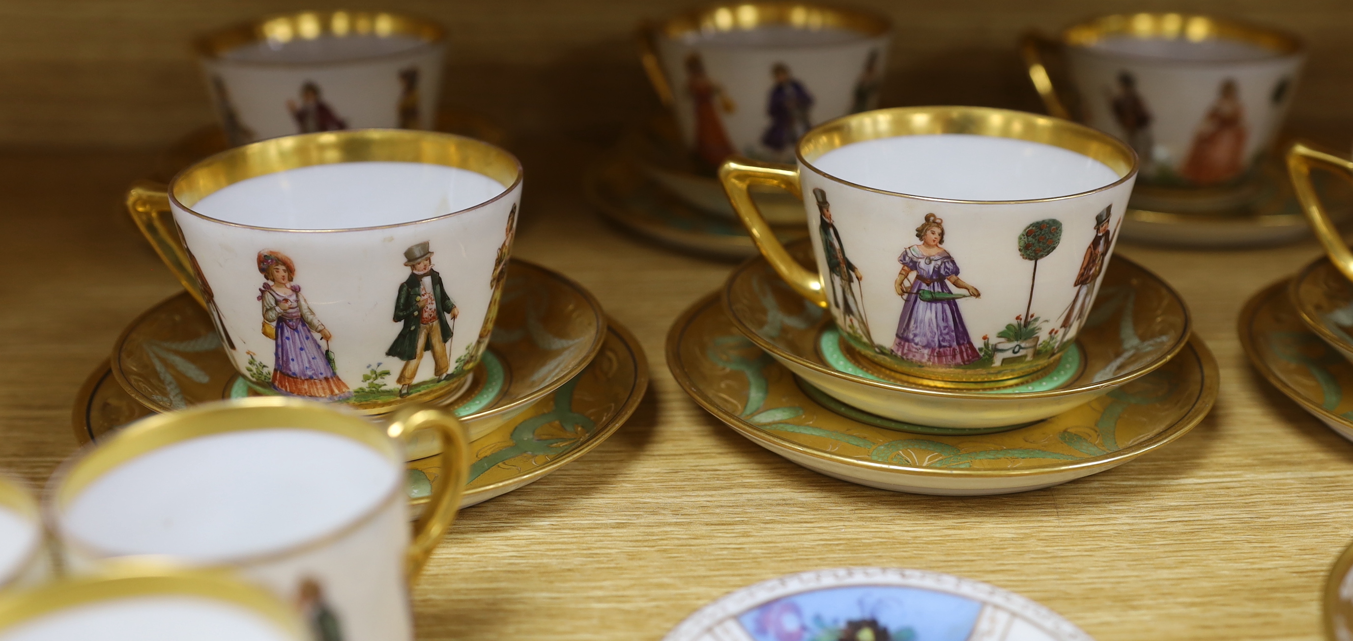A group of European porcelain tableware to include a pair of figures, Lowestoft jug, Dresden cups etc.